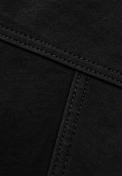Tonal double-needle topstitching where the yoke meets the side panel