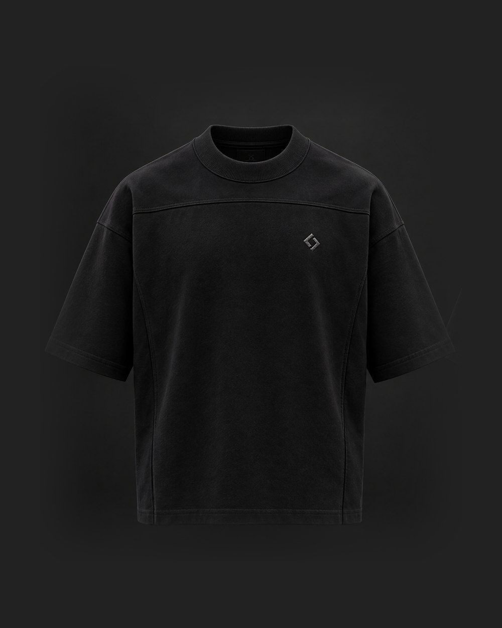 UMBRA Tee, front: boxy black heavyweight tee with a chest yoke and gunmetal emblem